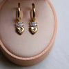 Thumbnail of Close-up of the Claddagh North Star Diamond Gold Earrings in 14k gold, showing the intricate detail of the Claddagh and the diamond setting.