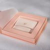 Thumbnail of Open blush pink Chupi luxury packaging sleeve, revealing a ring box inside.