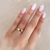 Thumbnail of Close-up of a hand wearing the Timeless Love 5mm Polished Wedding Band in 14k solid gold.