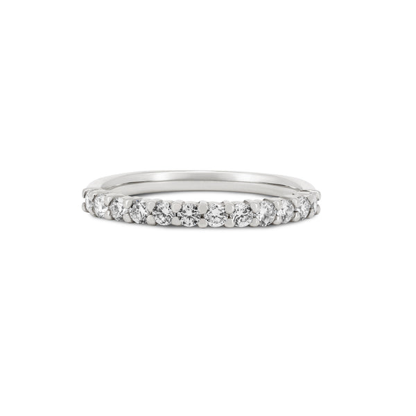 Front view of the Tomorrow Diamond Eternity Ring in 14k white gold with a polished band, featuring diamonds set across the top half of the band.