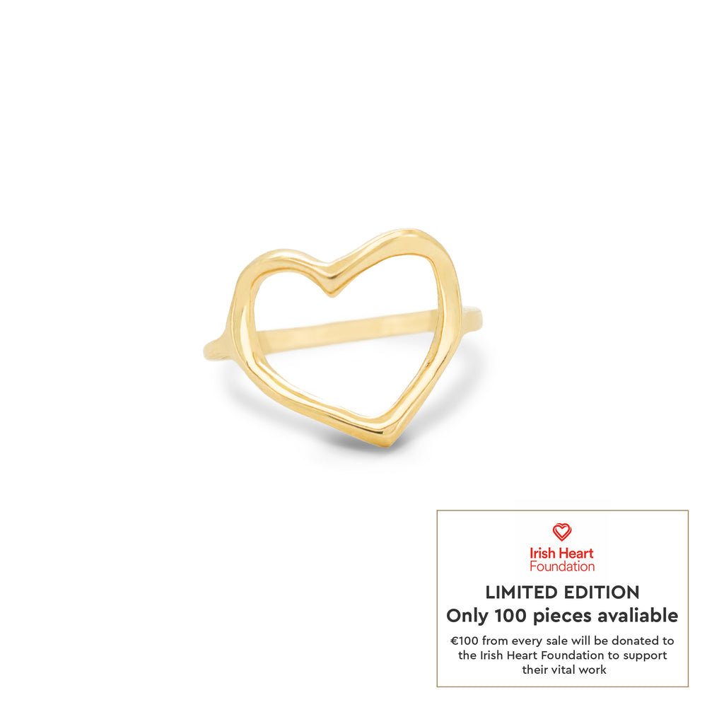 Front view of the I Carry Your Heart Limited Edition Ring in 14k solid gold, a polished band ring with a small, intricate heart motif.