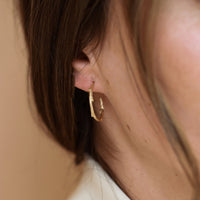 On-body shot of Hawthorn Twig - 14k White Gold Large Hoop Earrings