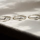Sterling Silver Sun, Moon & Star Ring Stack, on a marble table showing each seperate ring.