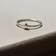 Side profile of the Sterling Silver Star Ring, showing the polished band and subtle star detail.