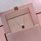 Full view of the Sterling Silver Sun Necklace, showcasing the full length of the delicate chain and sun pendant.