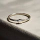 Close-up of a hand wearing the Sterling Silver Sun Ring, highlighting the polished band and sun detail.