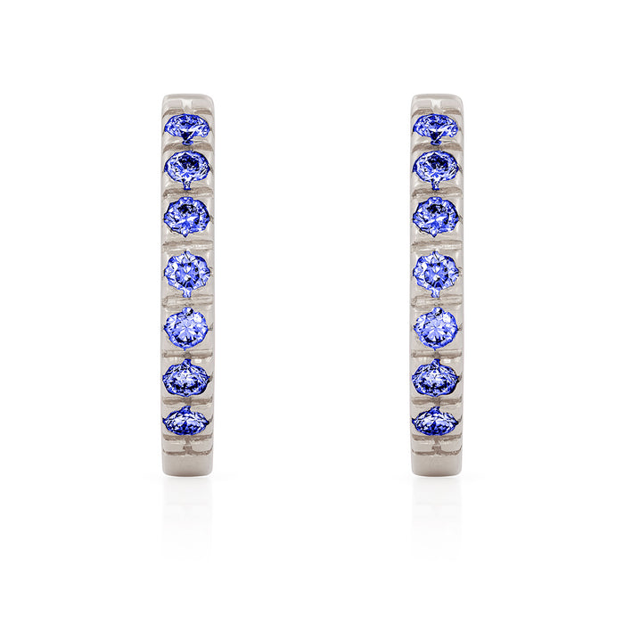 On-body shot of Tomorrow Eternity Huggie Earrings - 14k White Gold Sapphire Earrings