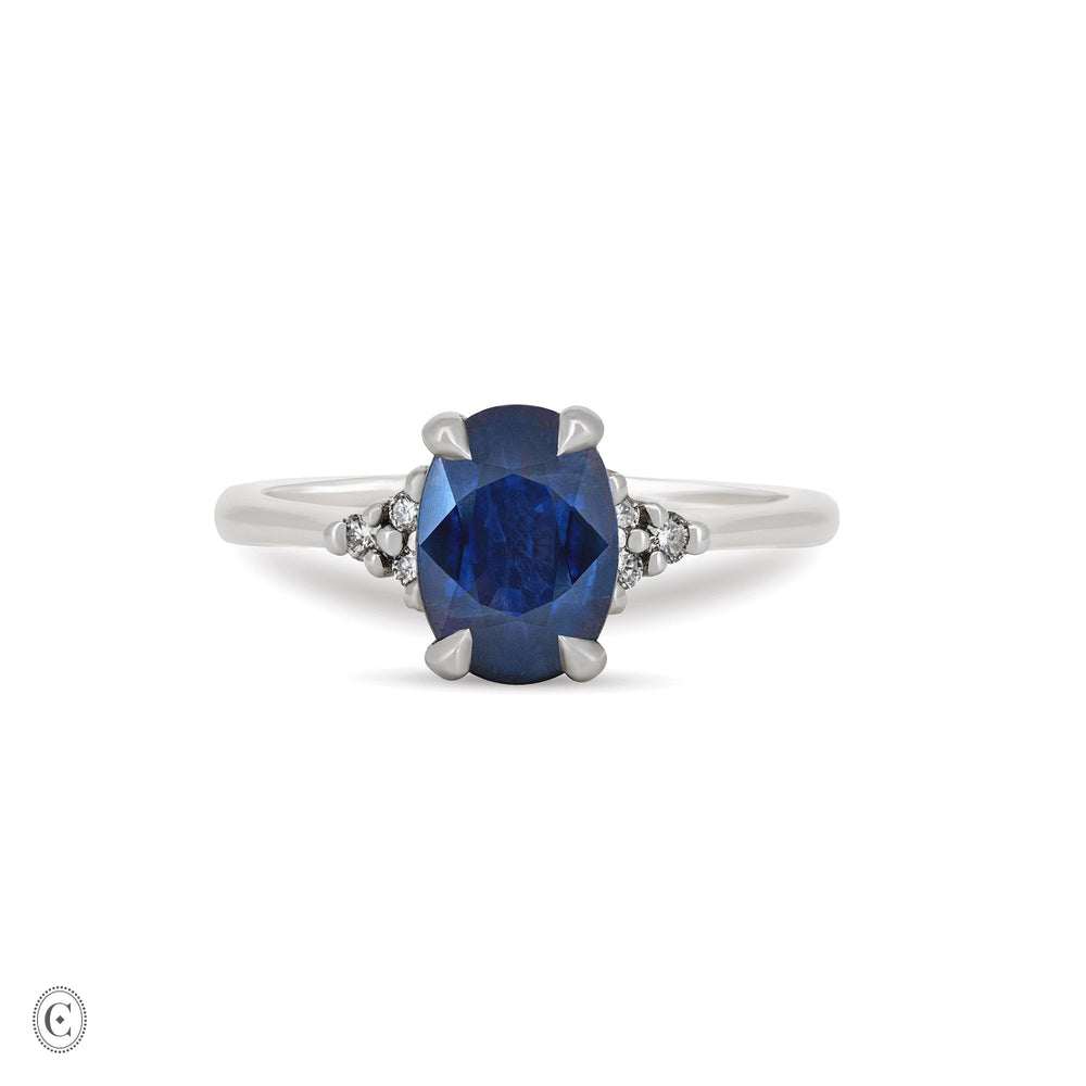 Front view of the Dewlight Blue Sapphire Engagement Ring in 14k solid white gold, featuring a large oval blue sapphire on a polished band.