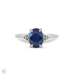 Front view of the Dewlight Blue Sapphire Engagement Ring in 14k solid white gold, featuring a large oval blue sapphire on a polished band.