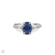 Front view of the Dewlight Blue Sapphire Engagement Ring in 14k solid white gold, featuring a large oval blue sapphire on a twig band.