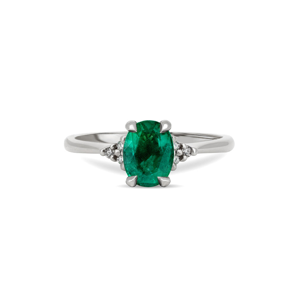 Front view of the Dewlight Emerald Engagement Ring in 14k white gold, featuring a large oval stone on a polished band.