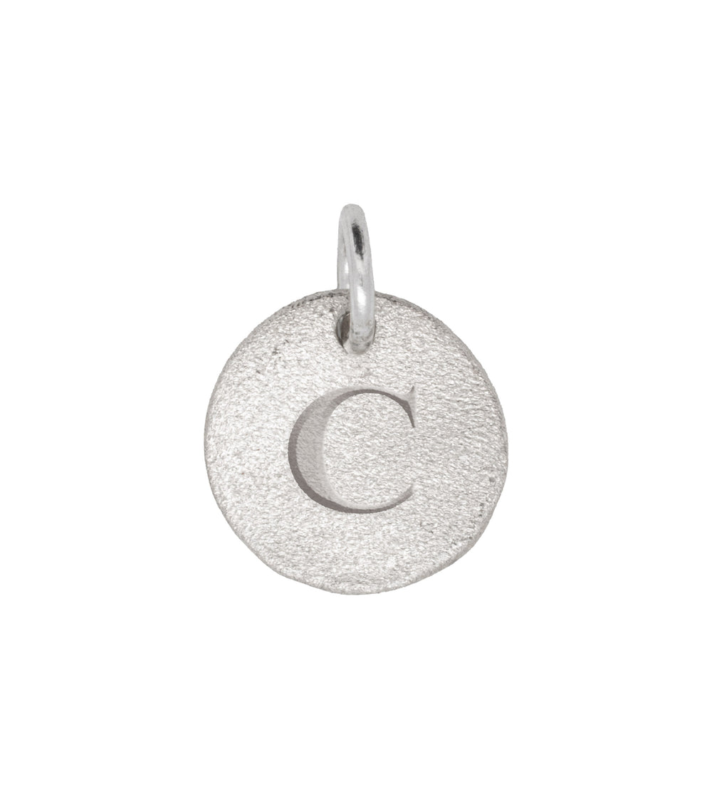 Close-up of the Individual Letter Disc in 14k white gold, engraved with the letter 'C' on a polished circular pendant.