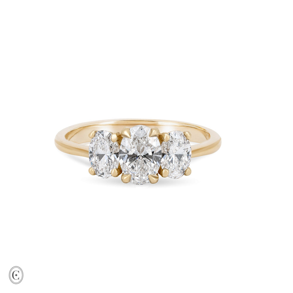 Front view of the Guiding Light Trilogy 1ct Oval Diamond Engagement Ring in 14k solid gold, featuring a central oval diamond flanked by two smaller diamonds on a polished band.