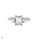 Front view of the Hero Emerald Cut Three Stone Diamond Engagement Ring in 14k solid white gold, featuring a central 1.5ct emerald-cut diamond flanked by two smaller diamonds on a polished band.