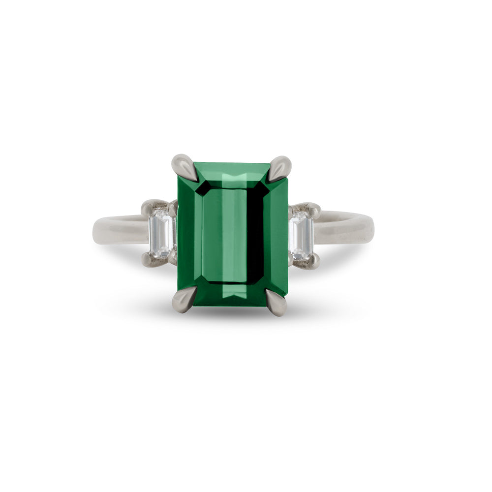 Front view of the Hero 1.8ct Green Tourmaline & Diamond Ring in 14k polished white gold, featuring a green tourmaline center stone and two small side diamonds.