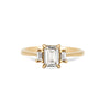 Thumbnail of Front view of the Hero Emerald Cut Three Stone Diamond Engagement Ring in 14k solid gold, featuring a central 1ct emerald-cut diamond flanked by two smaller diamonds on a polished band.