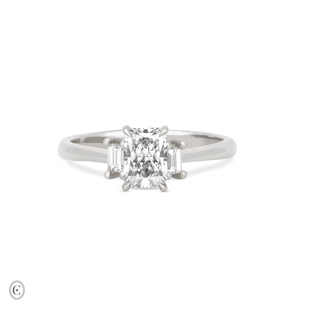 Front view of the Hero Radiant Cut Three Stone Diamond Engagement Ring in 14k white gold, featuring a central 1ct radiant-cut diamond flanked by two smaller diamonds on a polished band.