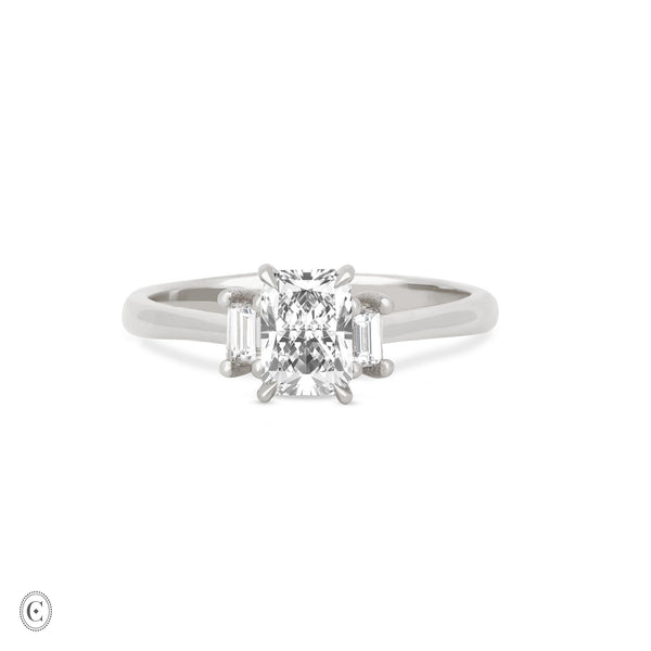 Front view of the Hero Radiant Cut Three Stone Diamond Engagement Ring in 14k white gold, featuring a central 1ct radiant-cut diamond flanked by two smaller diamonds on a polished band.