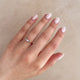 Close-up of a hand wearing the Daydreamer Marquise Lab Grown Diamond Ring in 14k polished gold.