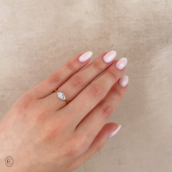 Alternative view of Close-up of a hand wearing the Eternal 0.7ct Lab-Grown Marquise Diamond Engagement Ring in 14k solid gold.