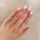 Close-up of a hand wearing the Everlasting Oval Eternity Ring in 14k gold.