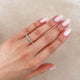 Close-up of a hand wearing the Forever Diamond Eternity Ring in 14k white gold.