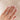 Alternative view of Close-up of a hand wearing the Moonlight Oval Diamond Engagement Ring in 14k solid gold, on a twig band.
