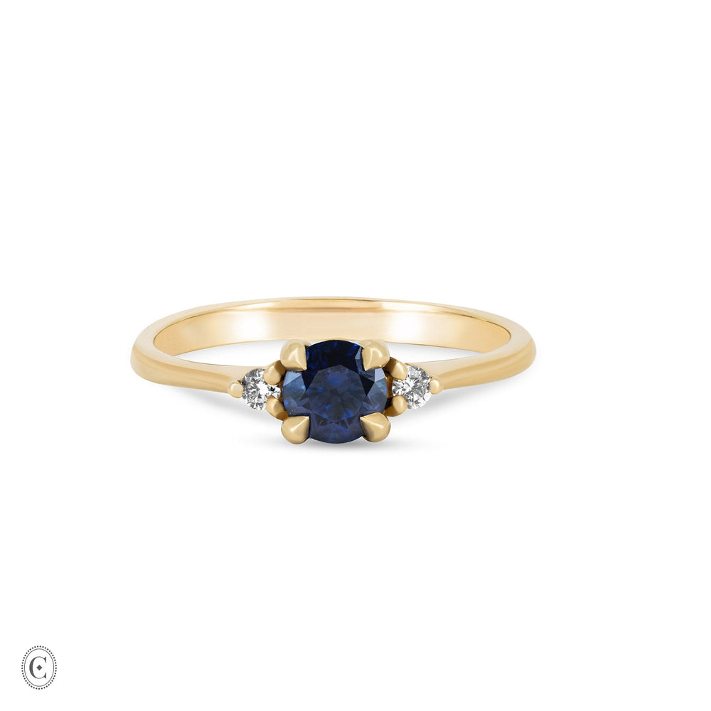 Front view of the Love is All Blue Sapphire Engagement Ring in 14k solid gold, featuring a blue sapphire on a polished band.
