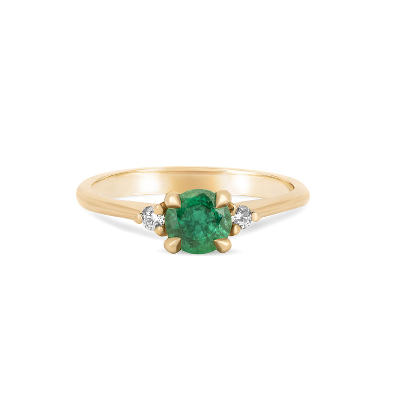 Front view of the Love is All Emerald Engagement Ring in 14k solid gold, featuring a brilliant cut emerald on a polished band.