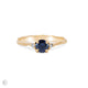 Front view of the Love is All Blue Sapphire Engagement Ring in 14k solid gold with a twig band.