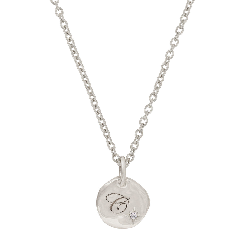 Front view of the North Star Diamond Engraved Initial Necklace in 14k white gold, featuring an engraved disc pendant with a small diamond.