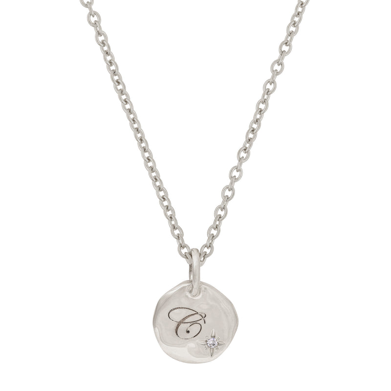 Front view of the North Star Diamond Engraved Initial Necklace in 14k white gold, featuring an engraved disc pendant with a small diamond.