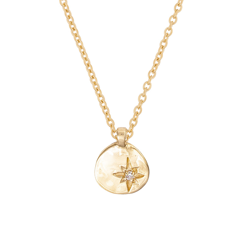 Front view of the North Star Diamond Necklace in 14k gold, featuring a small diamond-set star pendant.