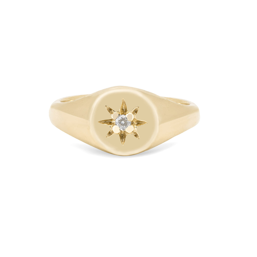 Front view of the North Star Lab Grown Diamond Original Signet Ring in 14k solid gold, featuring a solitaire diamond set in a starburst on a polished band.