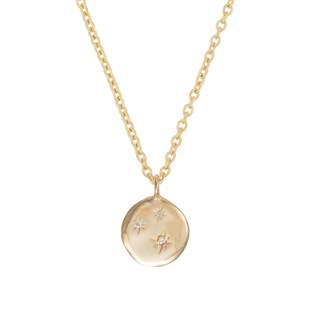 Front view of the Stars in the Sky Three Diamond Necklace in 14k gold, featuring three scattered diamonds on a round pendant.