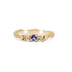 Thumbnail of Front view of the Sun, Moon & Stars Tanzanite Ring in 14k solid gold, featuring a round tanzanite stone flanked by sun, moon, and star motifs on a twig band.