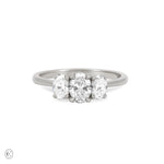 Front view of the Guiding Light Trilogy Oval Diamond Engagement Ring in 14k white gold, featuring a central oval diamond flanked by two smaller diamonds on a polished band.