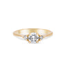 Thumbnail of Front view of the You, Me & Magic Round Cut Three Stone Engagement Ring in 14k solid gold, featuring a 0.5ct central round cut diamond flanked by two smaller stones on a polished band.