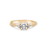 Thumbnail of Front view of the You, Me & Magic Round Cut Three Stone Engagement Ring in 14k solid gold, featuring a 0.5ct central round cut diamond flanked by two smaller stones on a twig band.