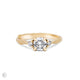 Front view of the You, Me & Magic Round Cut Three Stone Engagement Ring in 14k solid gold, featuring a 0.7ct central round cut diamond flanked by two smaller stones on a twig band.