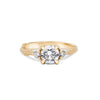 Thumbnail of Front view of the You, Me & Magic Round Cut Three Stone Engagement Ring in 14k solid gold, featuring a 1ct central round cut diamond flanked by two smaller stones on a twig band.
