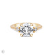 Front view of the You, Me & Magic Round Cut Three Stone Engagement Ring in 14k solid gold, featuring a 2ct central round cut diamond flanked by two smaller stones on a polished band.