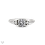 Front view of the You, Me & Magic Grey Diamond Engagement Ring in 14k white gold, featuring a polished band and a large central grey diamond flanked by two smaller diamonds.