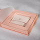 Luxury box exposing a blush jewelery pouch to hold jewellery.