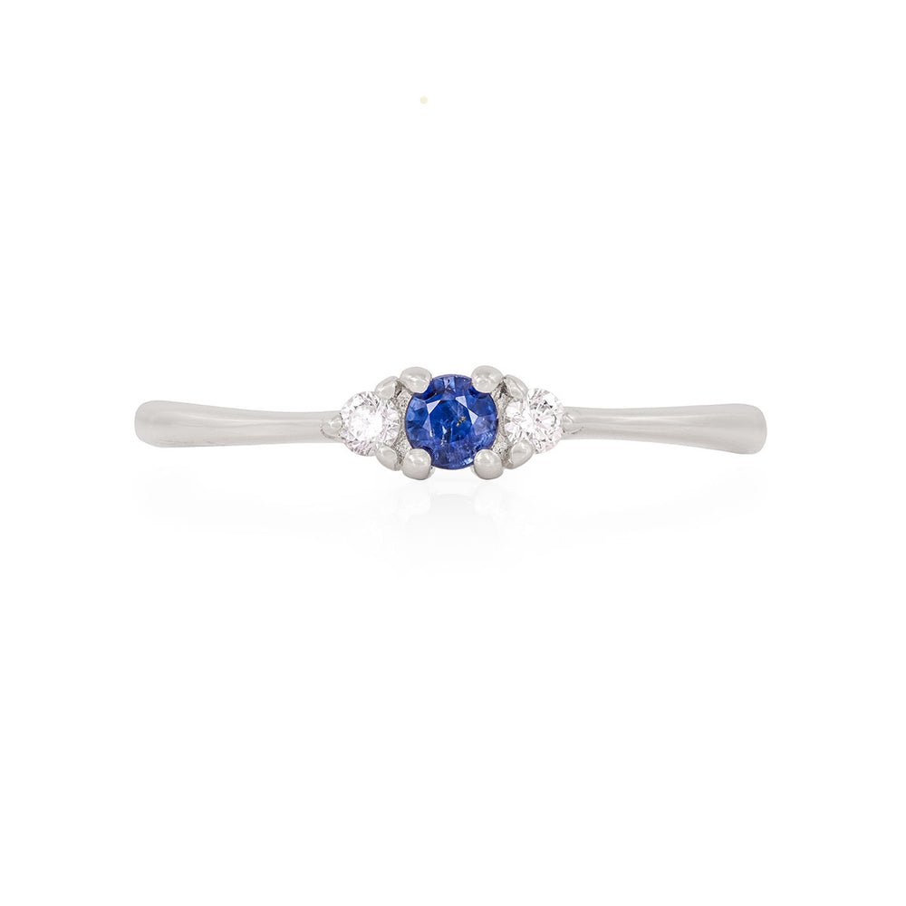 Front view of the Promise me Tomorrow Blue Sapphire Ring in 14k polished white gold, a solitaire ring with a round blue sapphire.