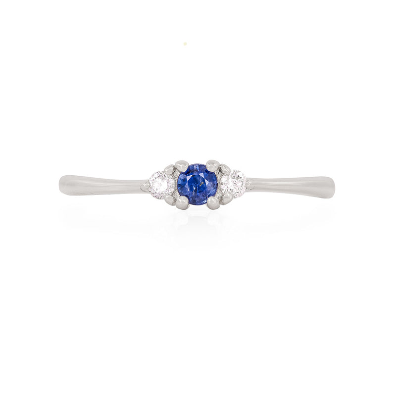 Front view of the Promise me Tomorrow Blue Sapphire Ring in 14k polished white gold, a solitaire ring with a round blue sapphire.