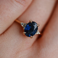 On-body shot of Dewlight 1ct Blue Sapphire Oval Engagement Ring - 14k Gold Polished Band