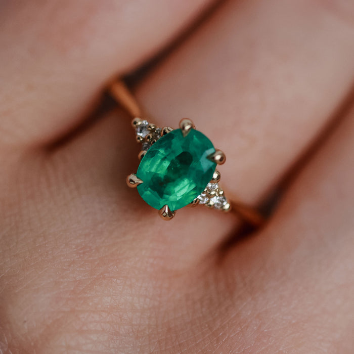 On-body shot of Dewlight 1ct Emerald Oval Engagement Ring - 14k Gold Polished Band