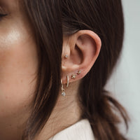 On-body shot of Moon - 14k Gold Diamond Stud Earrings
